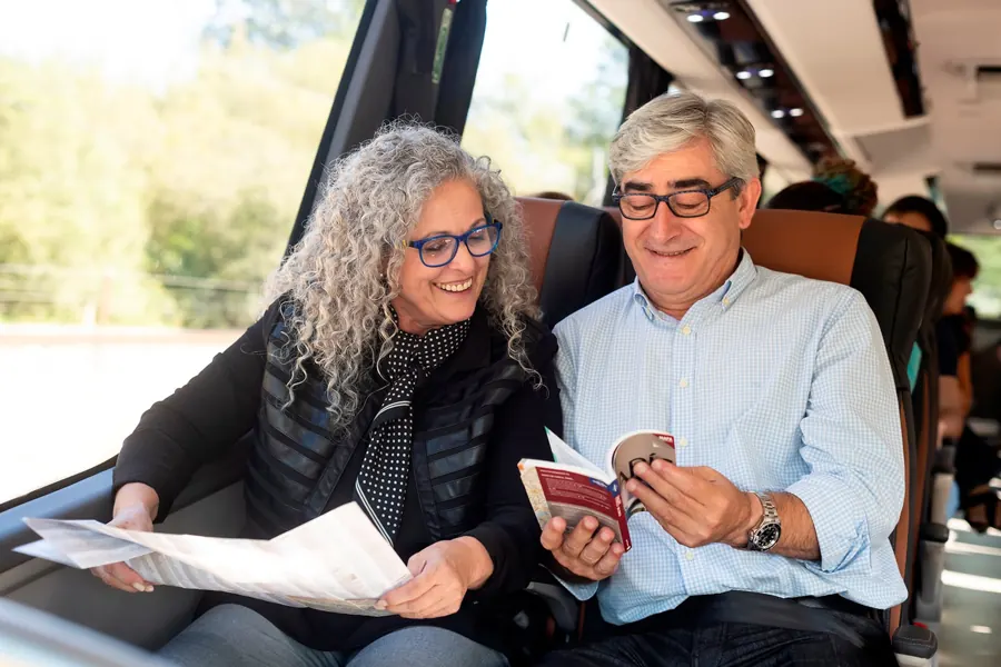 Passengers relaxing on board an Australia Wide Coaches coach