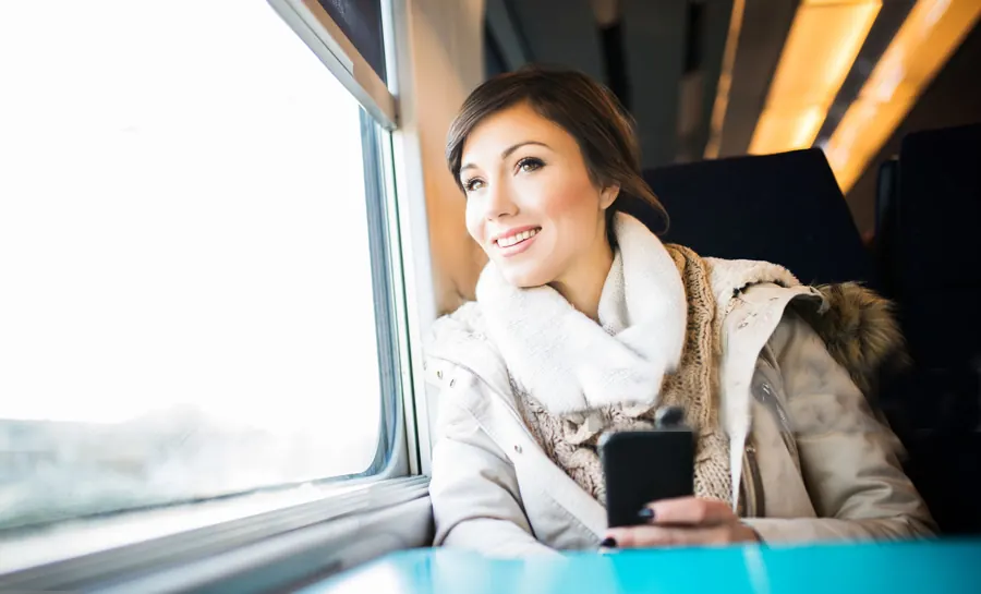 Passenger relaxing by the window on board